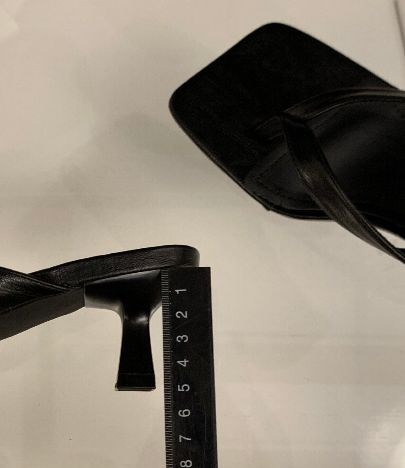 Black Camille toe-post sandal with measured slim heel