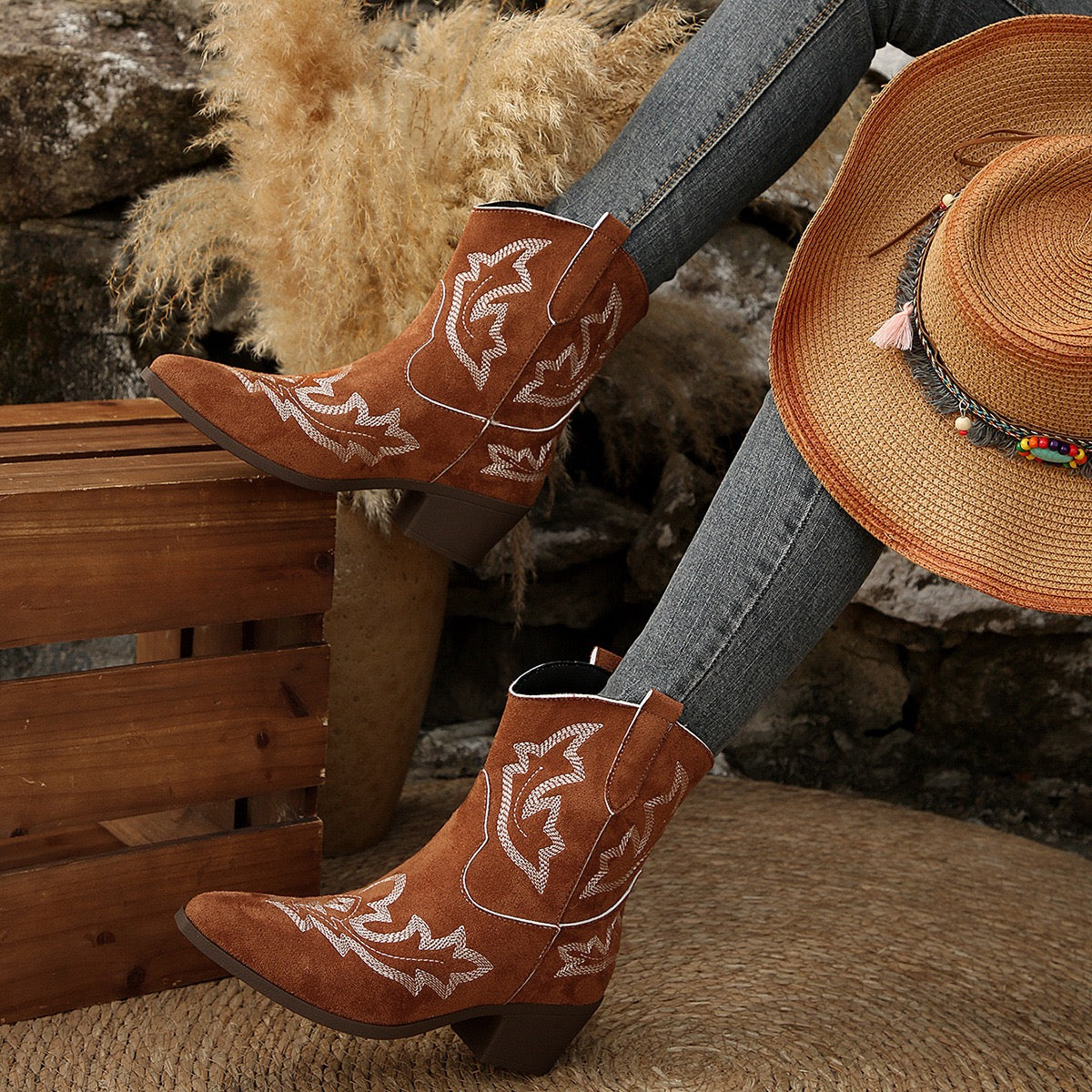 Dakota brown Western ankle boots, seated lifestyle view