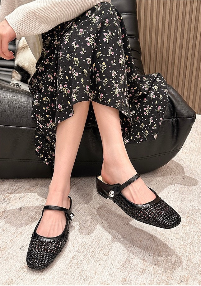 Black Elowen woven flats styled on foot