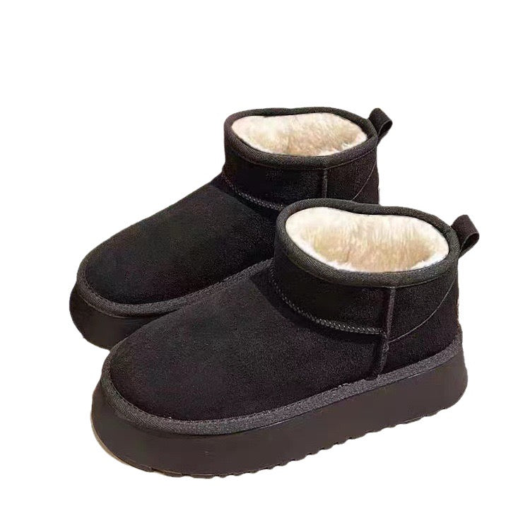 Black faux-fur-lined platform snow boots pair
