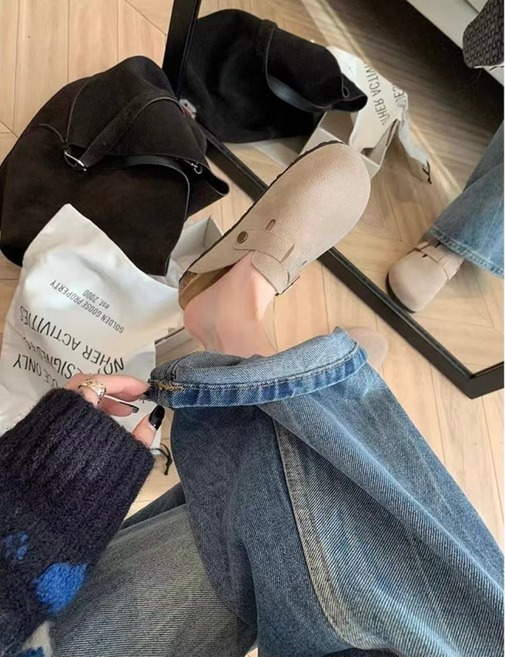 Maren Leather Buckle Mules in Light Taupe, denim styling side view