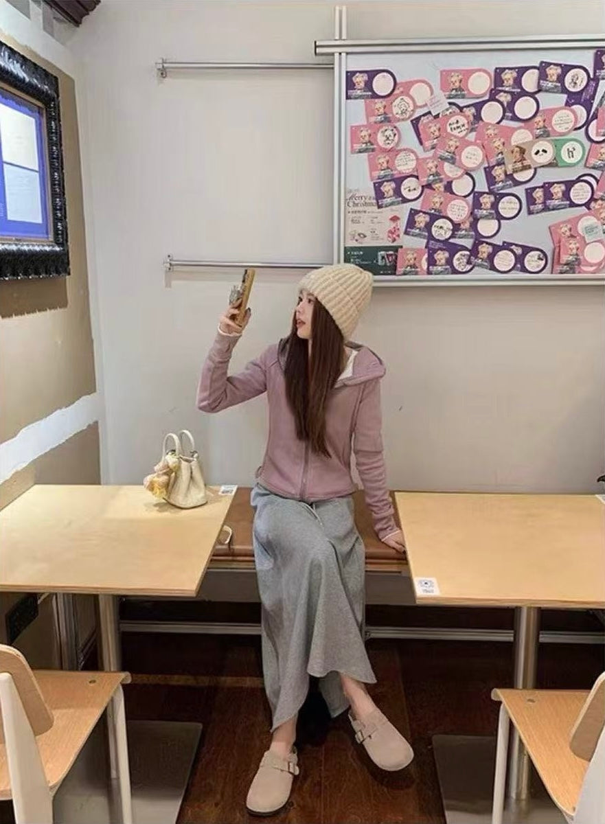 Maren Leather Buckle Mules in Light Taupe, seated outfit