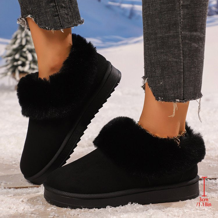 Black faux-fur-trimmed slip-on snow boots lifestyle view
