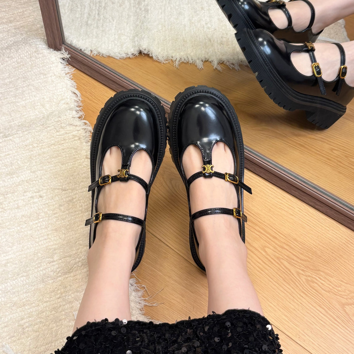 Black patent double-buckle platform Mary Janes mirror styling