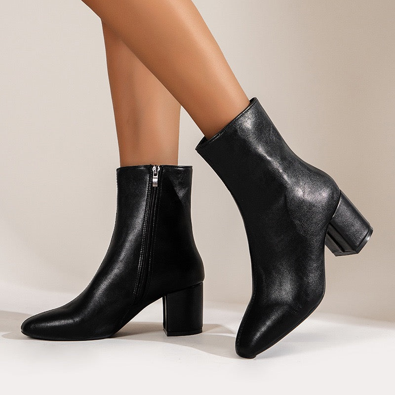 Sloane black ankle boots, side lifestyle view