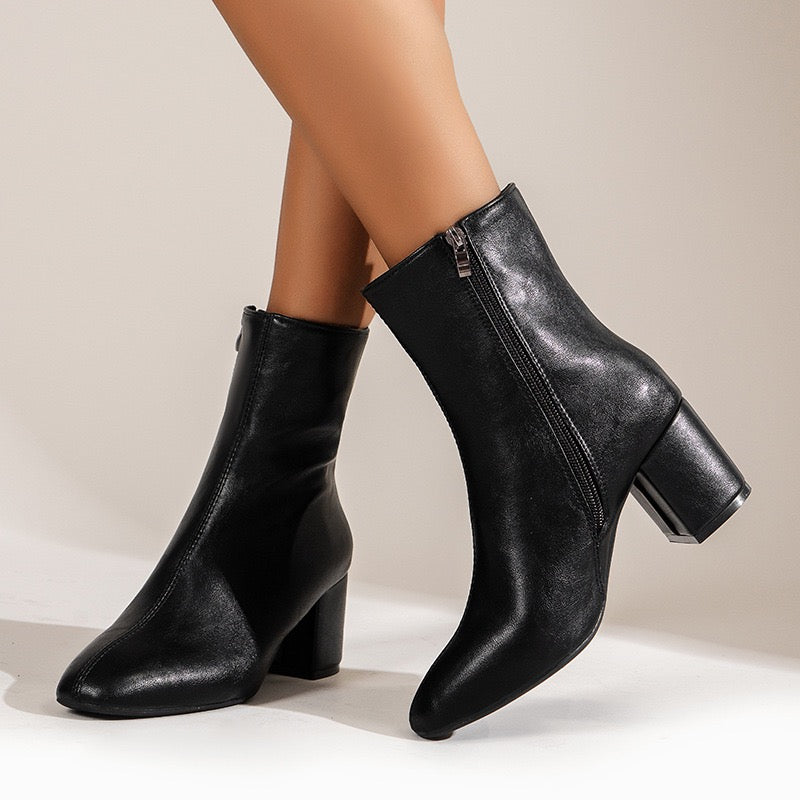 Sloane black ankle boots, walking view